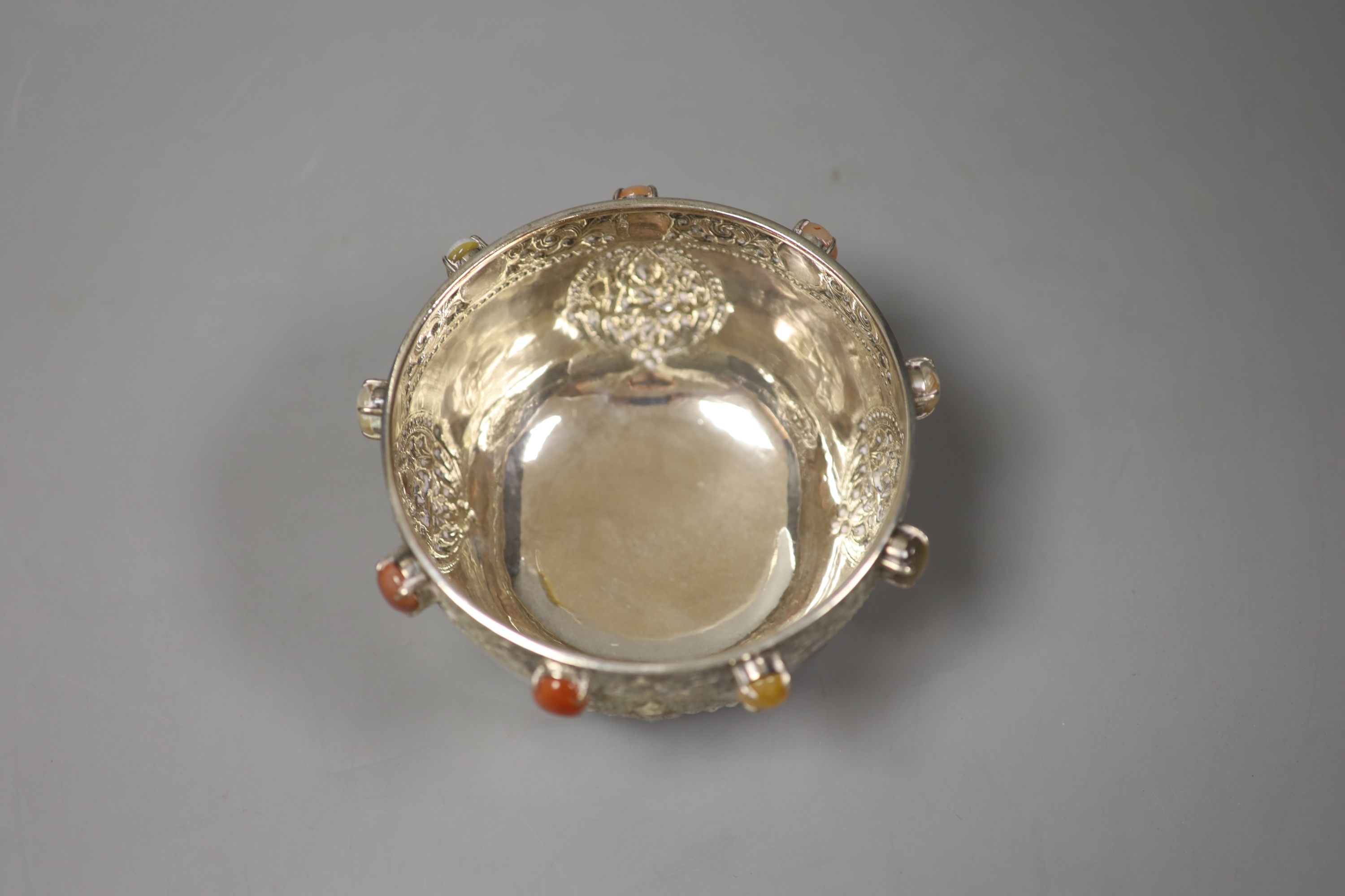 A Thai circular white metal bowl inset hardstone cabochon,